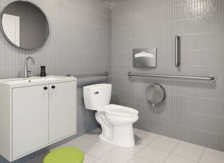 Commercial restroom featuring a pressure-assisted toilet with ADA handrails 