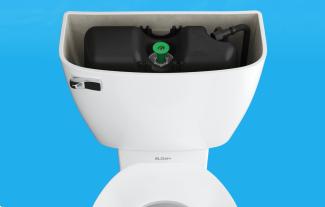 Sloan pressure-assisted toilet tank with lid off showing a Flushmate 0.75 gpf vessel inside.